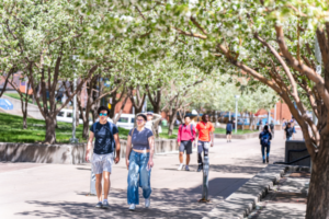 students walking on campus in spring